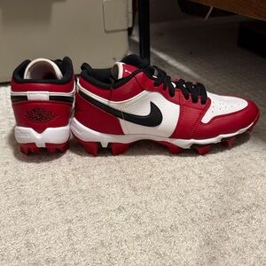 Red and white air jordan cleats